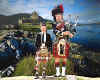 000311 GB: Piper at Eilean Donan Castle