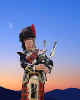 000315 GB: Scottish Piper at dusk
